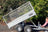Trailer bed angled in tipping action.