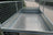 Inside view of a mesh sided trailer showing the checkerplate aluminium floor.