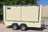 side view of an ivory catering style trailer with closed hatch