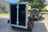 rear view of a black boxxa trailer with closed barn doors and steel surround. 