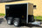 side view of a twin axle black boxxa with 2 of the 4 wheels visible.