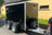 a twin axle black boxxa trailer with steel surround and front mounted spare wheel.