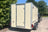 Rear view of an ivory coloured enclosed trailer showing a rear door