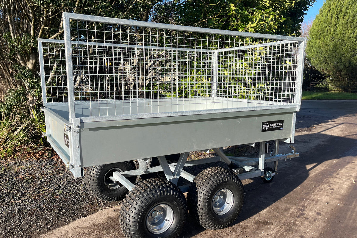 Galvanised steel trailer with mesh sides and view of rear gate.