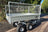 Galvanised steel trailer with mesh sides and view of rear gate.